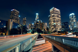 los angeles downtown night with urban buildings light trail